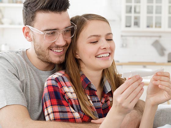 Young-Happy-Couple-Checking- Pregnancy test image