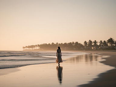 divorce image of woman walking on beach