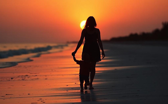 sunset beach image of woman/daughter